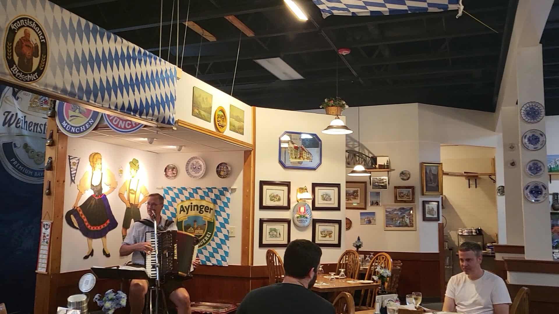 German decor and photos lining the walls at Bavarian Grill in Plano, Texas