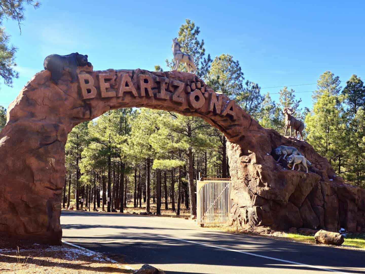 Sculpted BEARIZONA entrance arch with animal statues, Williams, Arizona