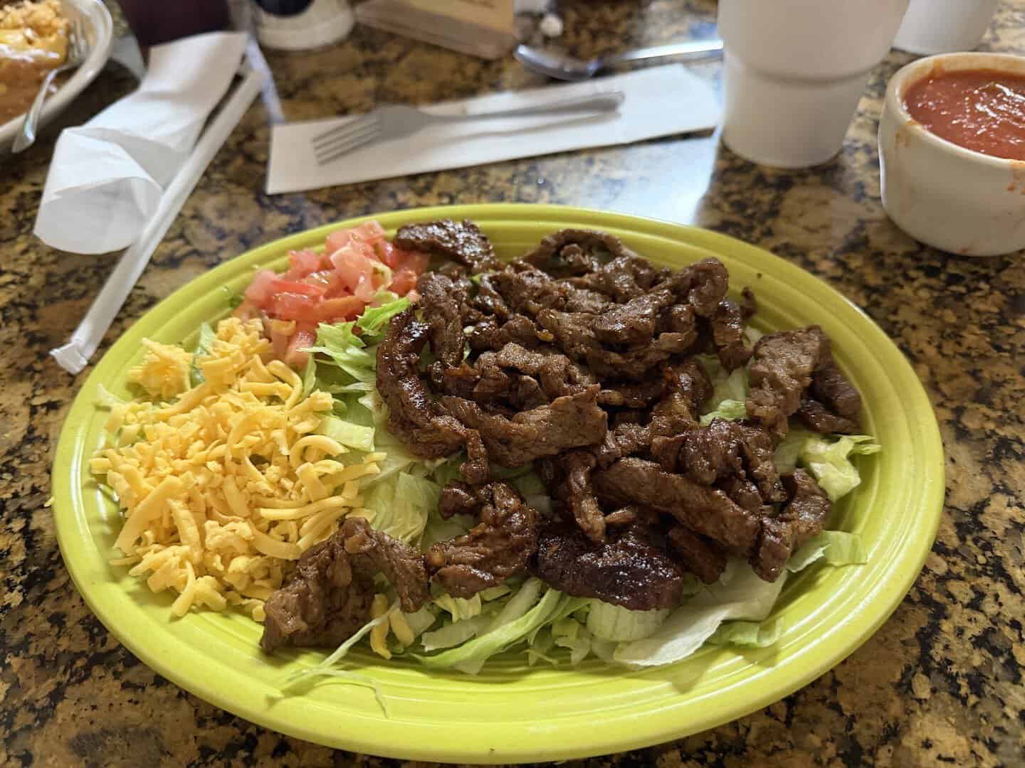 Beef fajita plate with cheese and lettuce at Eddie's Taco House in San Antonio