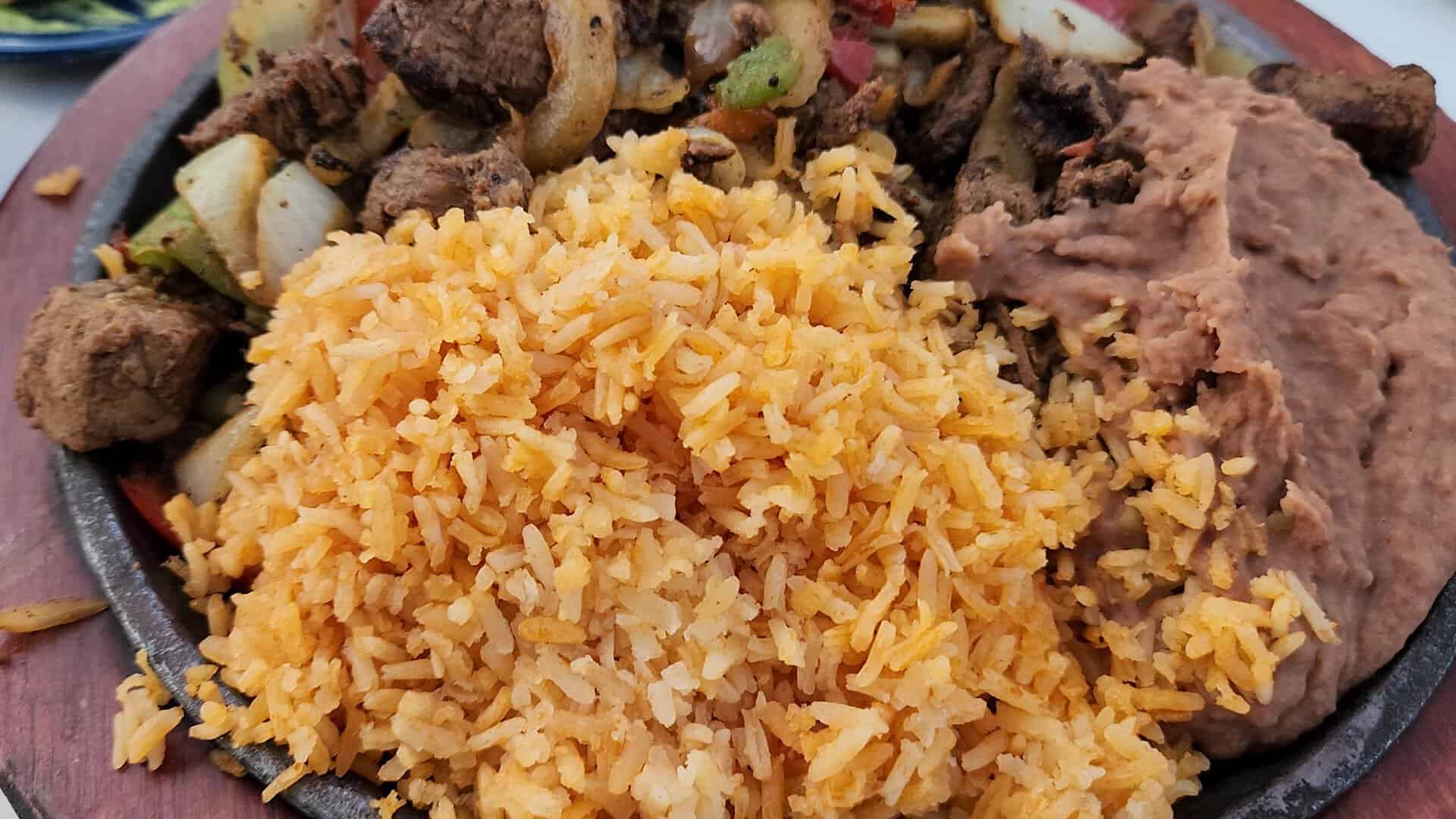 Beef fajita plate with Mexican rice and refried beans at Joe T. Garcia's in Fort Worth