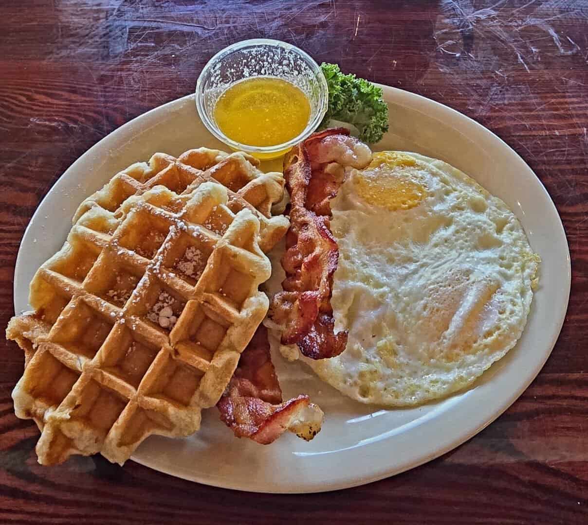 Belgian waffle with bacon and eggs at Miller's Seawall Grill in Galveston, Texas