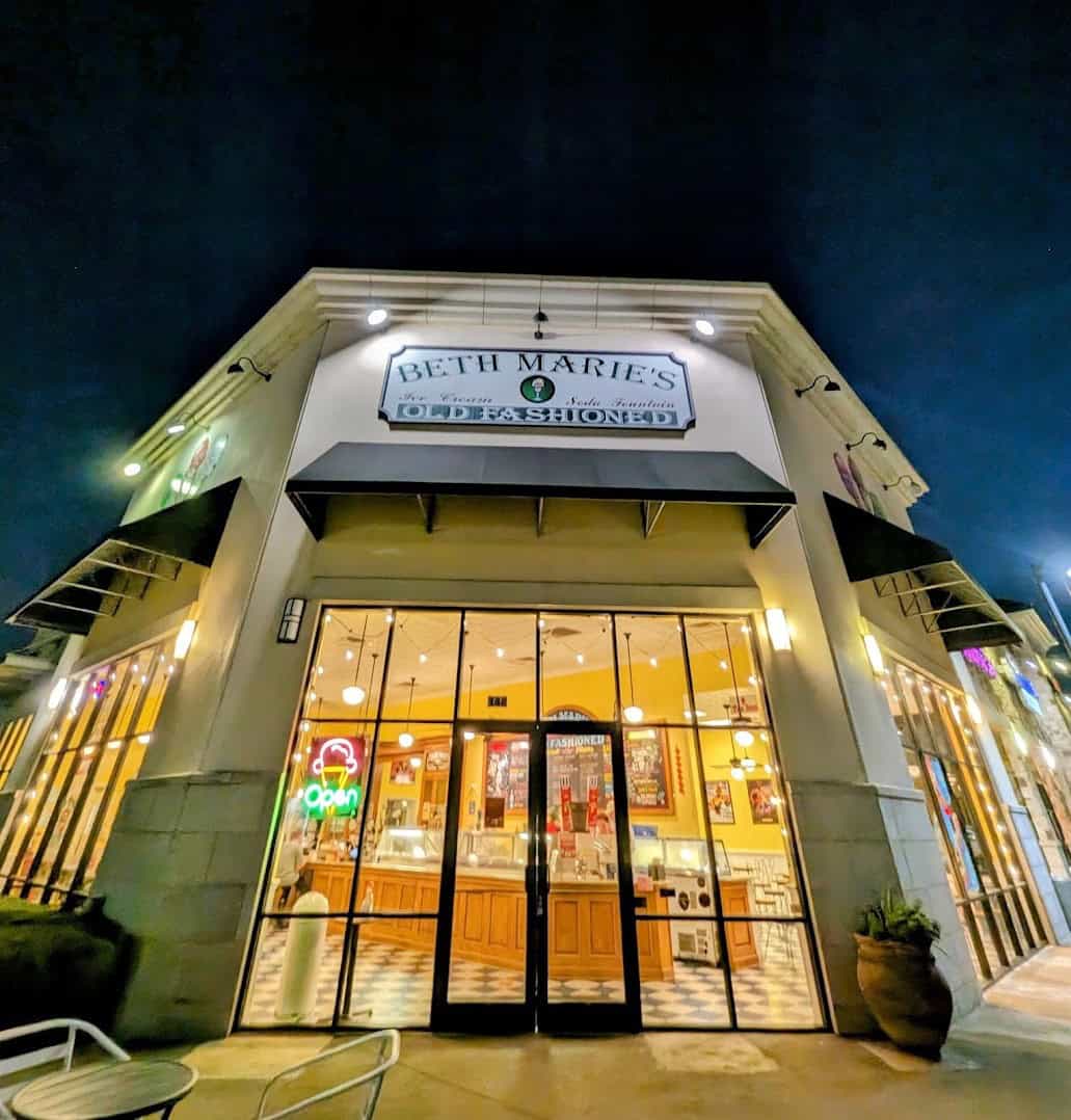 Beth Marie's Old Fashioned Ice Cream storefront lit up at night in Denton