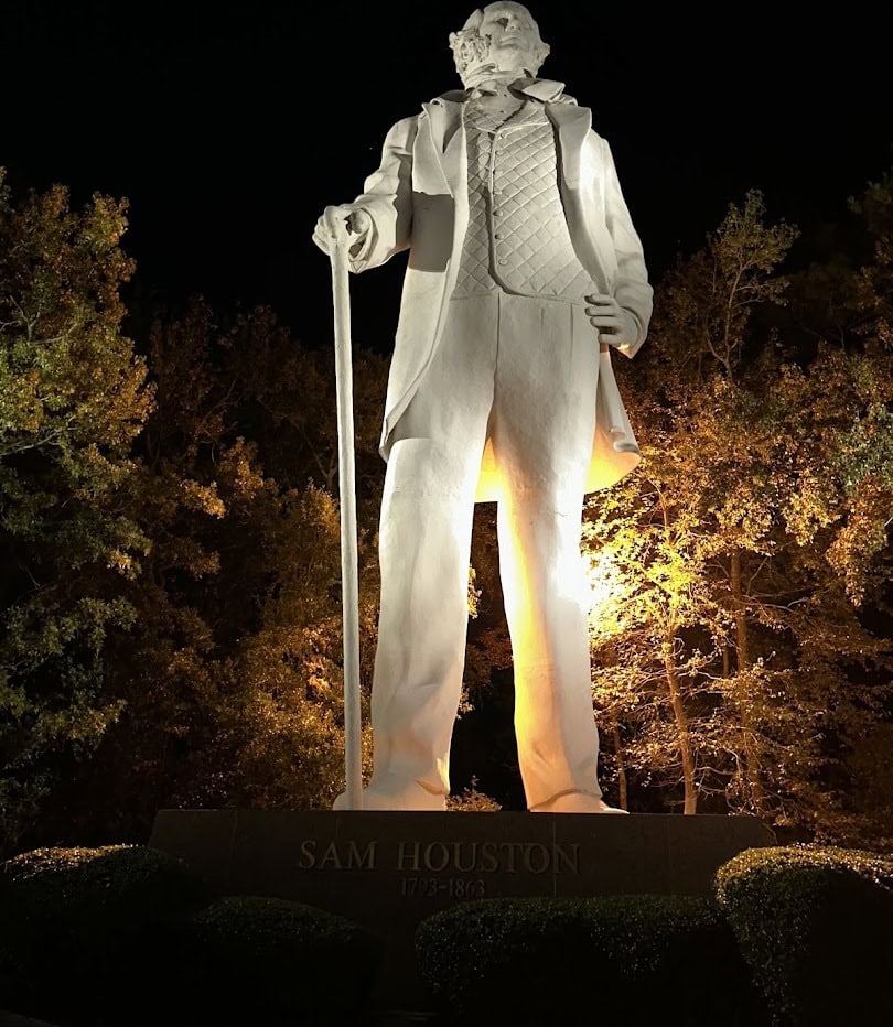 The Sam Houston statue lit up at night in Huntsville