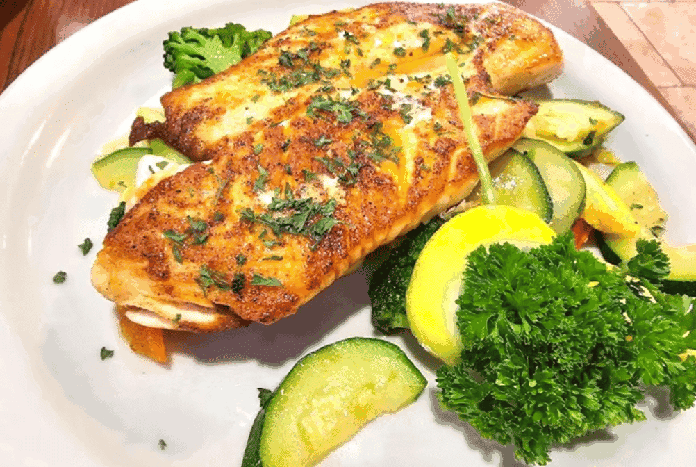 Blackened redfish fillet with vegetables at Baytown Seafood in Baytown, Texas