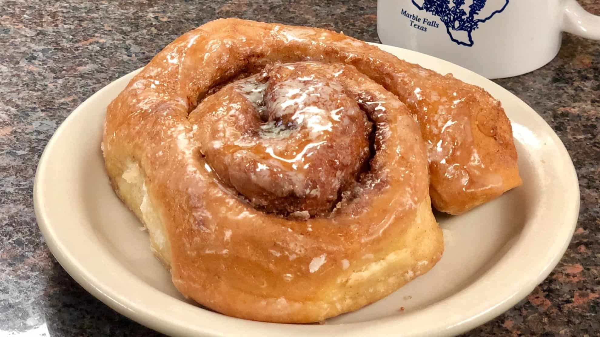 Warm cinnamon roll at Blue Bonnet Cafe in Marble Falls, Texas