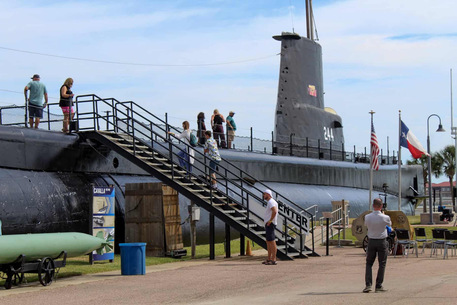 Visitors climbing the stairs to board the USS Cavalla submarine at Seawolf Park, Galveston