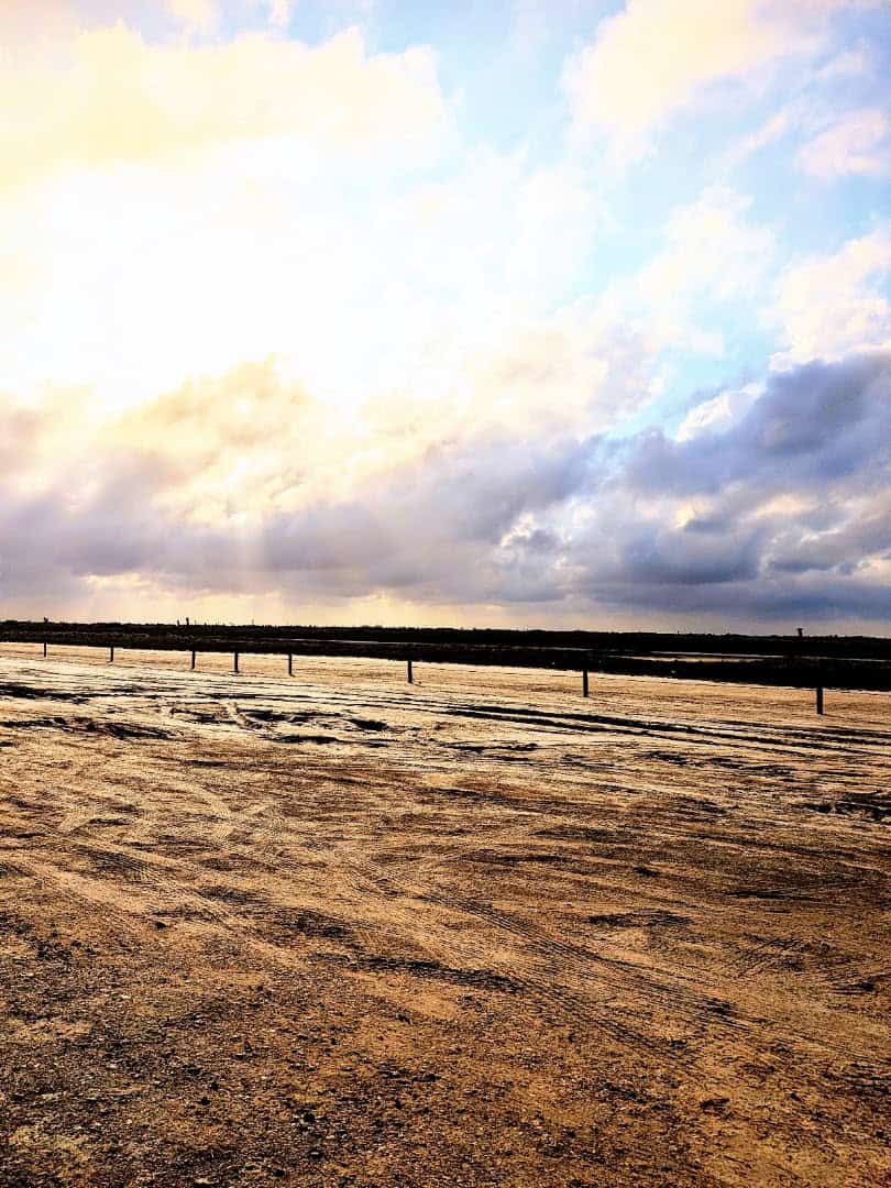Golden sunset sky over the water at Boca Chica Beach, Texas