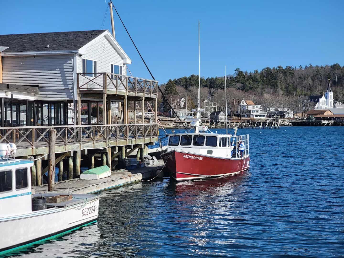 A red lobster boat in the working harbor at Boothbay Harbor, Maine