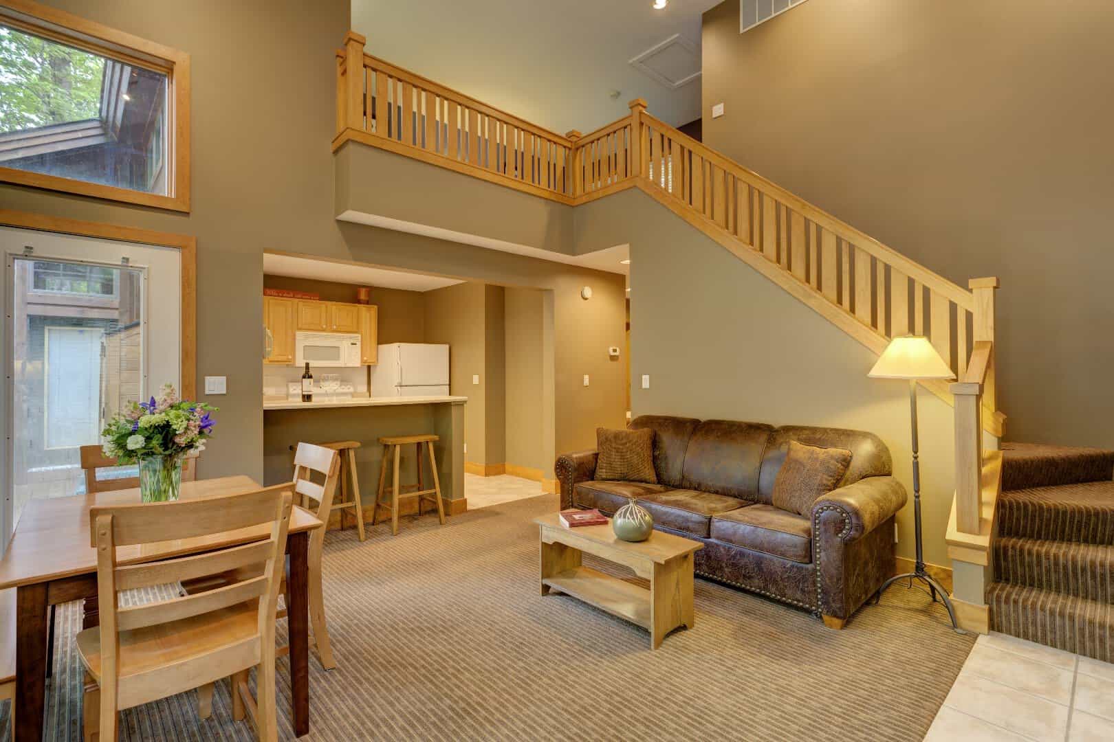 Warm lodge living room with a loft at Boyne Mountain Resort, Boyne Falls, Michigan