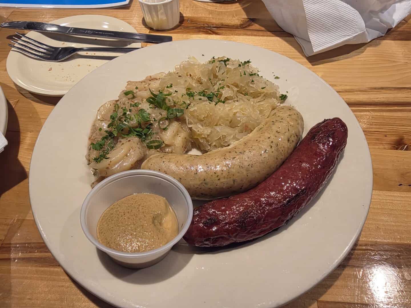 Bratwurst with spaetzle and gravy at Bavarian Grill in Plano, Texas