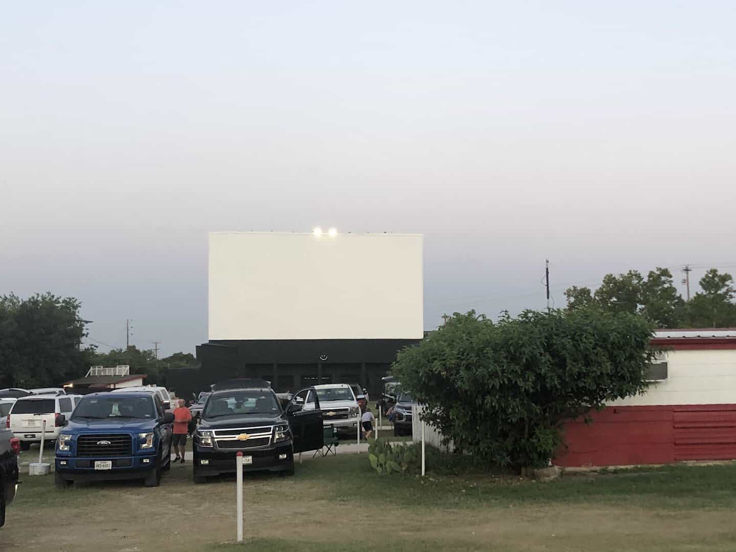 The screen and parked cars at Brazos Drive-In in Granbury, Texas