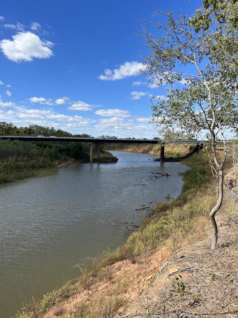 The Brazos River beside the trail at Brazos River Park in Sugar Land, Texas