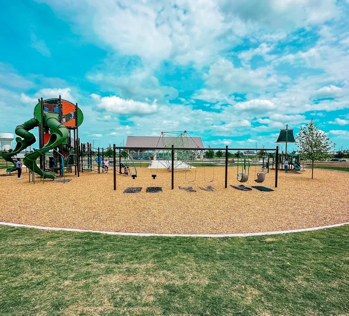 Large playground and shaded pavilion at Brazos River Park in Sugar Land, Texas