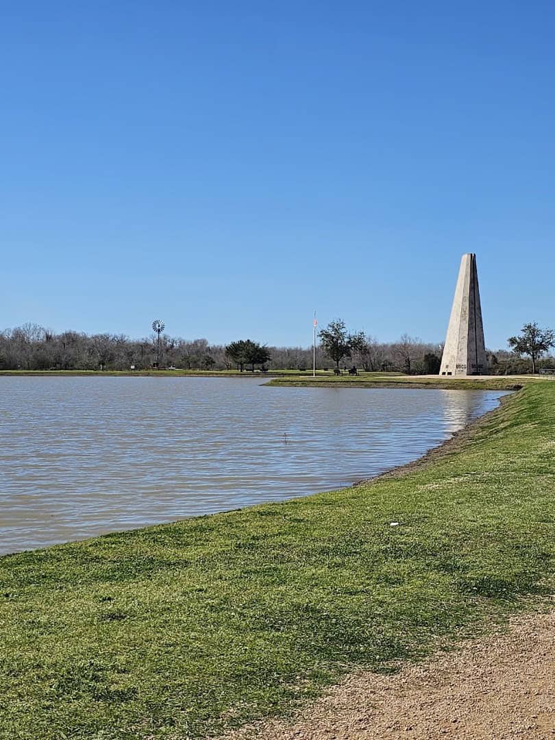 Lake and memorial along the connected riverfront parks in Sugar Land, Texas