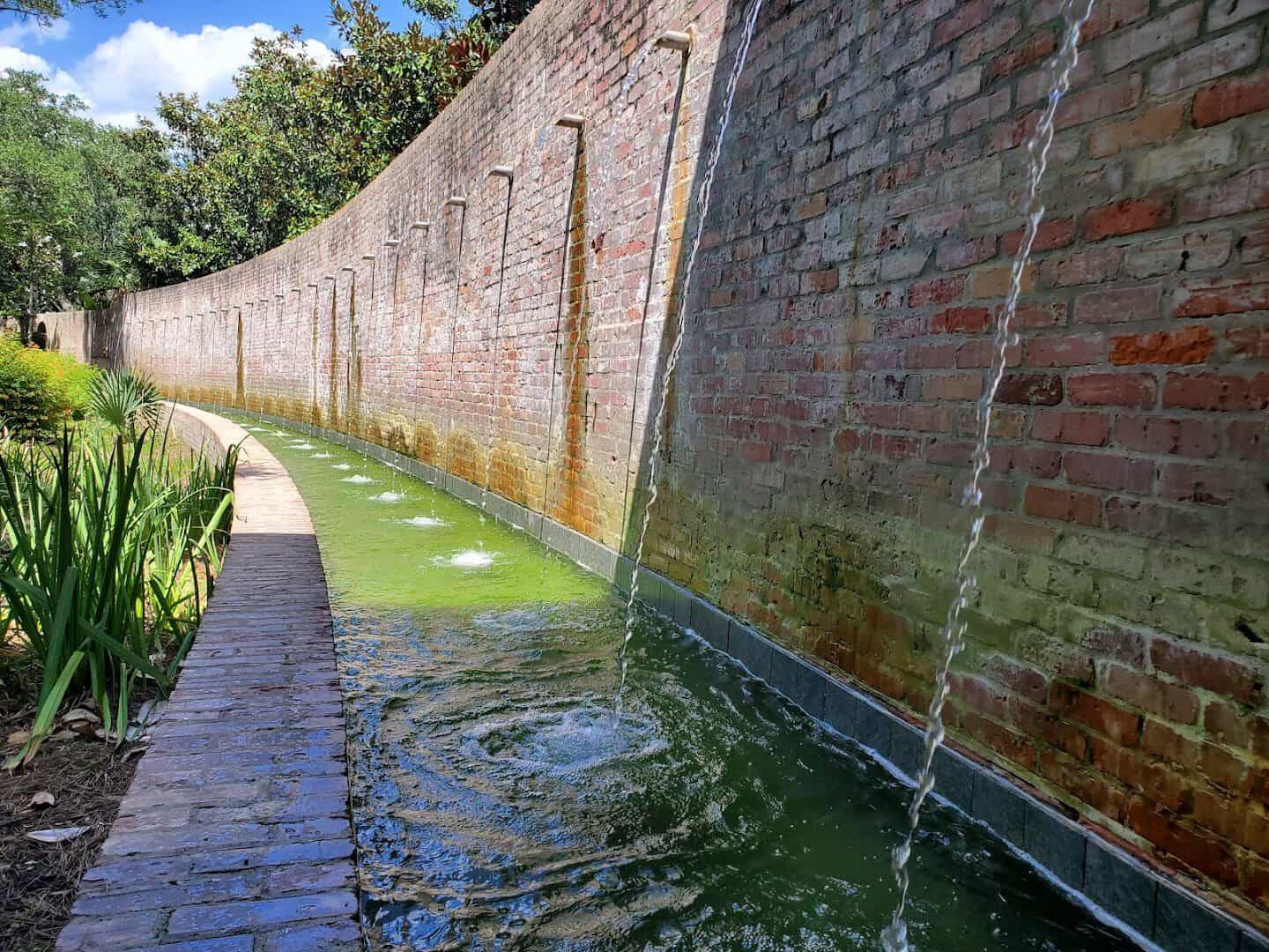 Long brick reflecting pool water feature at Shangri La Botanical Gardens in Orange, Texas