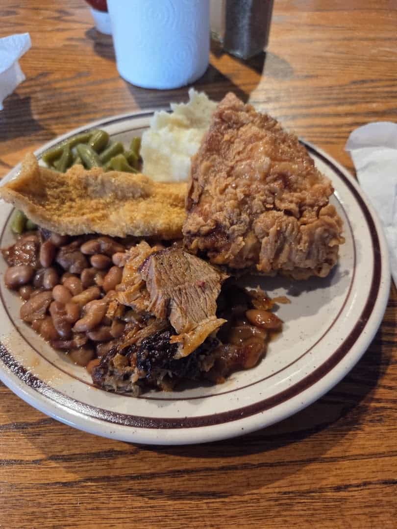 Pit-smoked brisket with fried catfish, pinto beans and cornbread at Sam's Original Restaurant in Fairfield, Texas