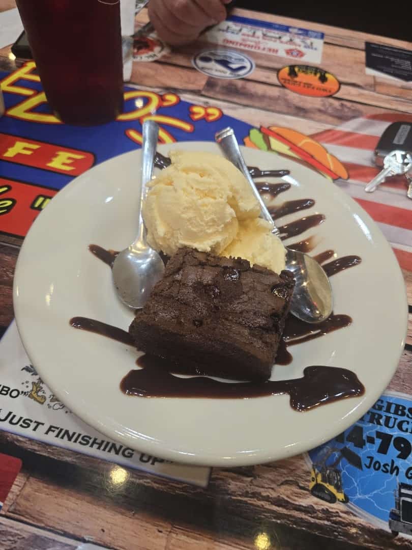 Homemade brownie with vanilla ice cream and chocolate drizzle at Bebo's and Kathy's Cafe