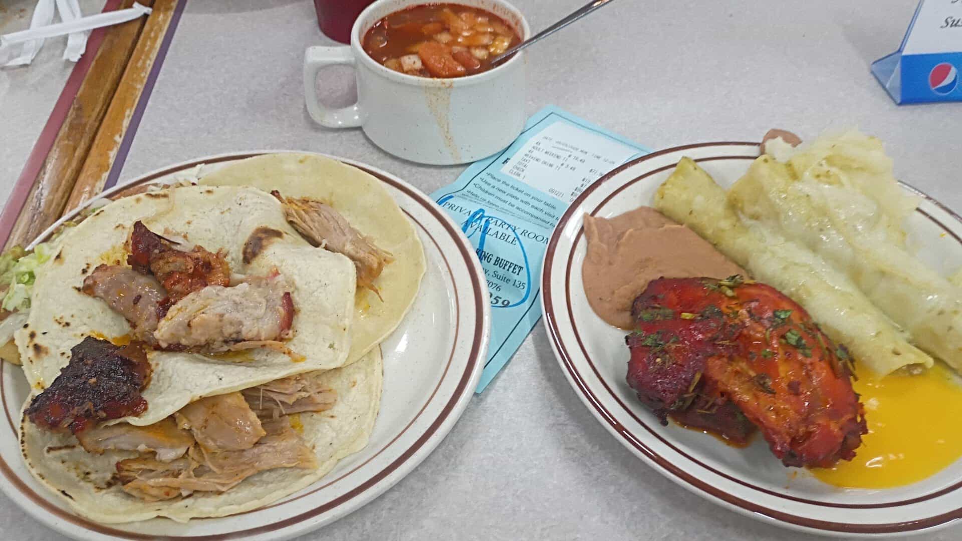 Plate of grilled meat, enchilada and soup at Ranchero King Buffet in Houston