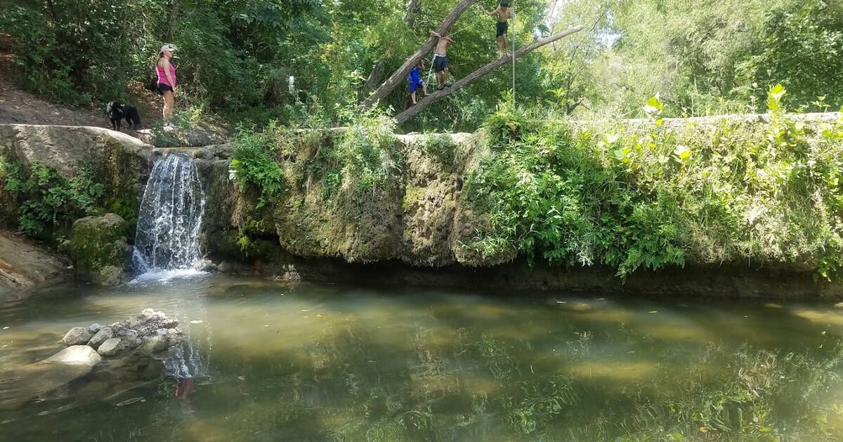 This Easygoing 2.7-Mile Texas Trail Ends at a Secret Waterfall and Hills Full of Wildflowers