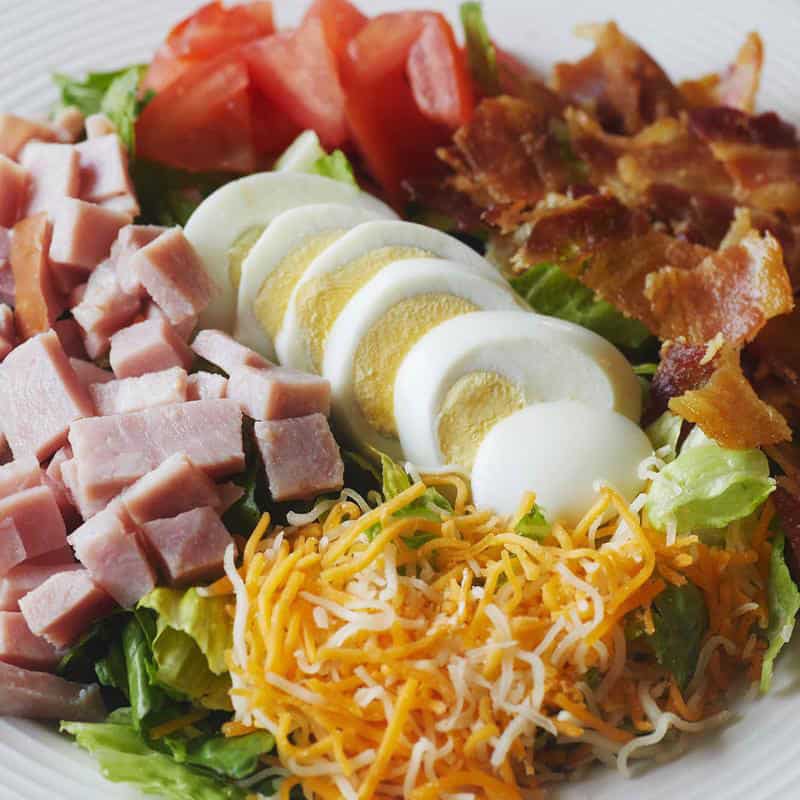 Loaded chef salad with tomatoes, cheese and toppings at Hill Country Cupboard