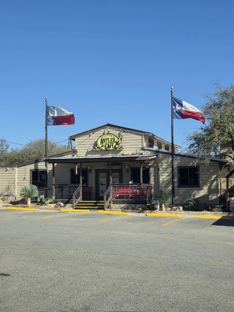 Front of Richter's Antler Cafe in Spring Branch with the Texas flag flying
