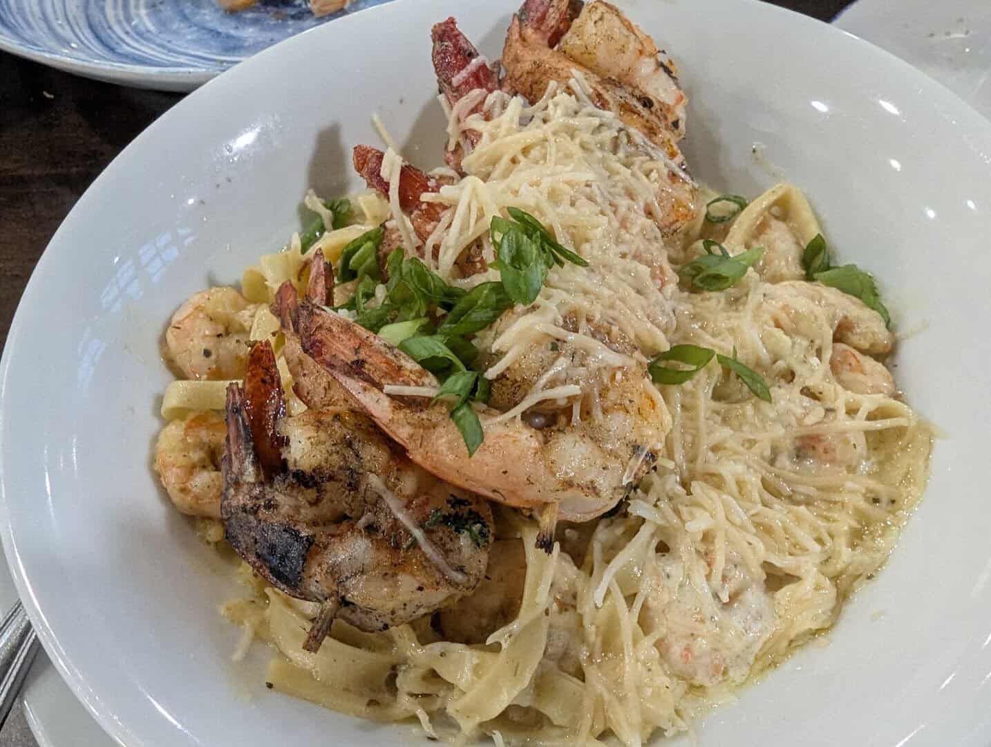 Mom's Cajun shrimp pasta topped with grilled Gulf shrimp at Katie's Seafood House