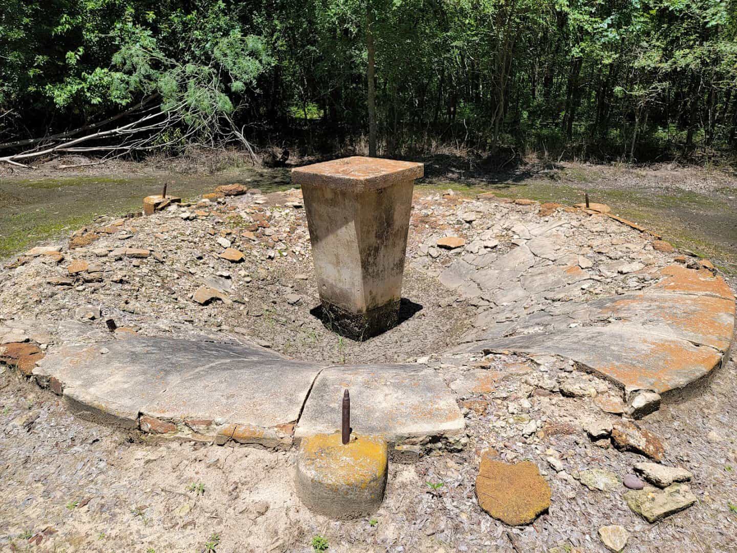 Remains of a prisoner built fountain in the woods at Camp Hearne