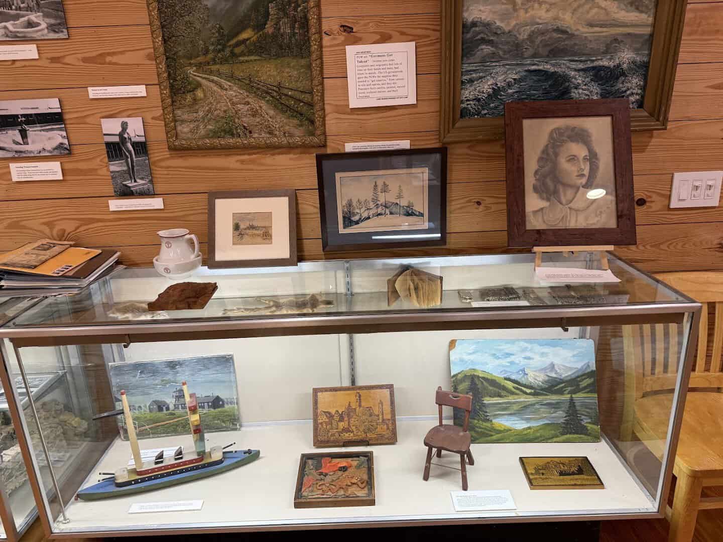 Prisoner watercolors, carvings and a model ship on display at Camp Hearne