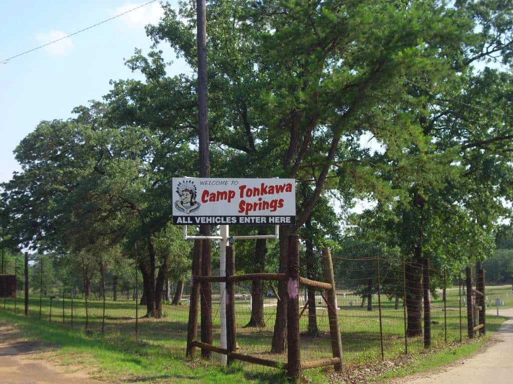 The entrance sign at Camp Tonkawa Springs in Garrison, Texas
