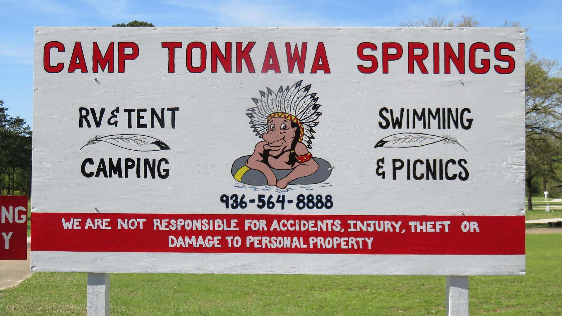 The Camp Tonkawa Springs sign for RV and tent camping, swimming and picnics