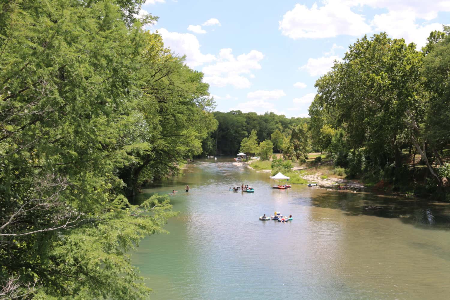 Kayakers paddling the clear water near Canyon Lake