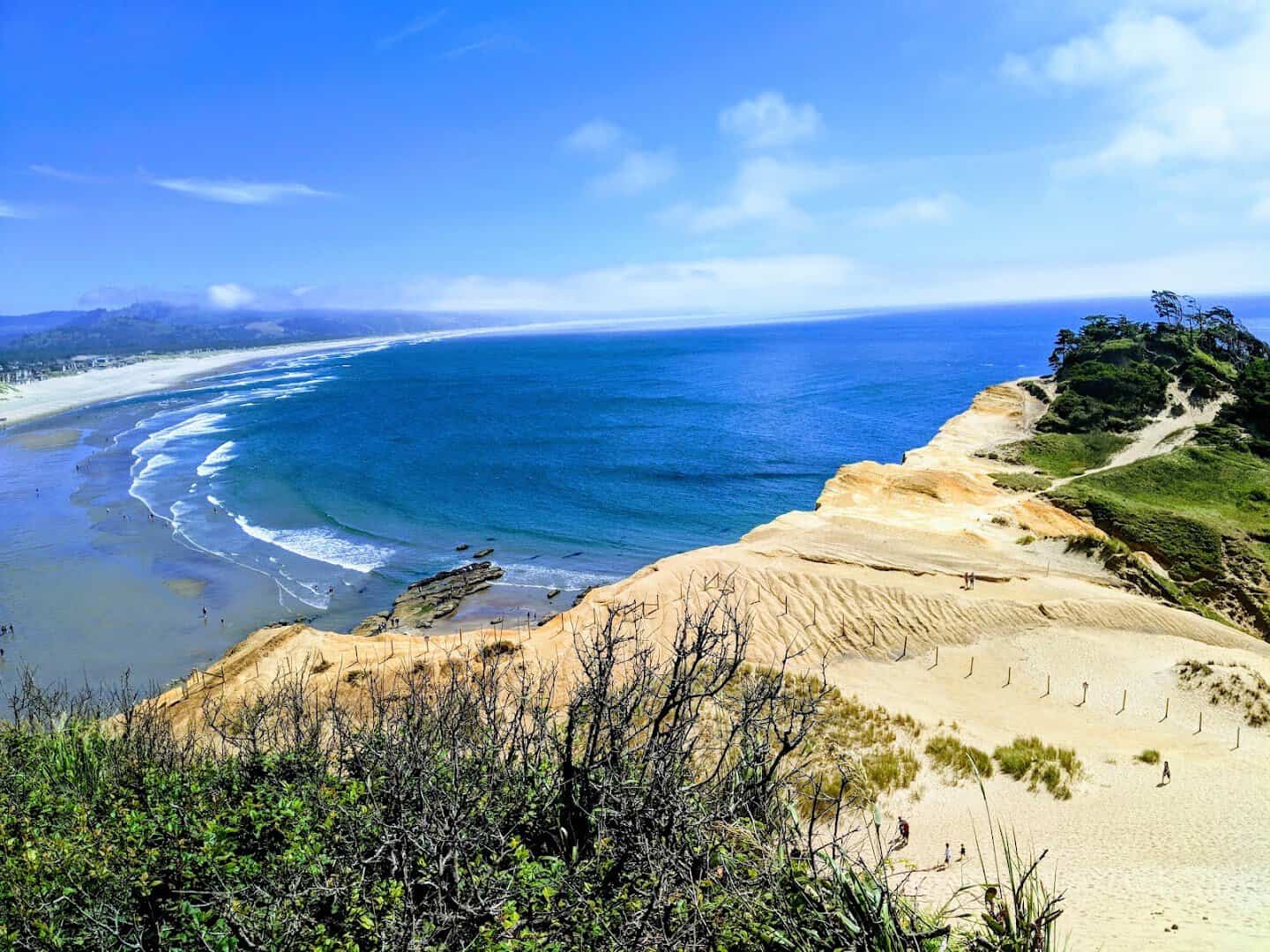 The sandstone dune above the curving beach and blue Pacific at Cape Kiwanda, Pacific City, Oregon