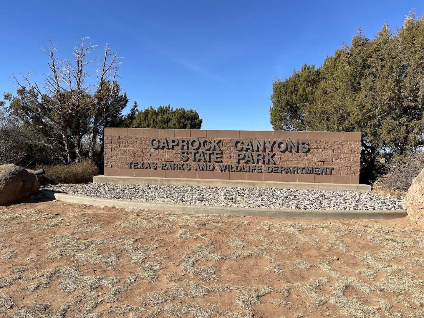 The Caprock Canyons State Park entrance sign near Quitaque, Texas
