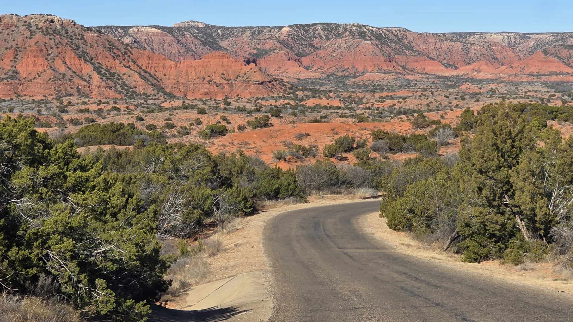 Red dirt trail winding through the canyon at Caprock Canyons State Park, Texas