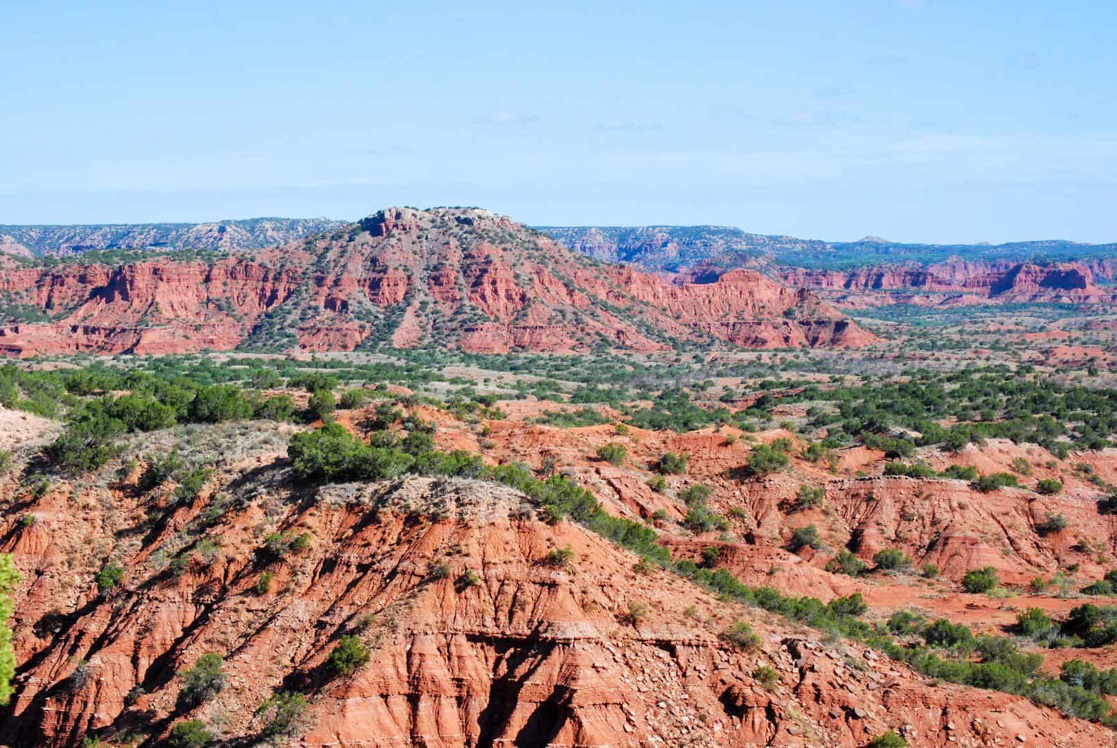 Banded red rock cliffs and canyon panorama at Caprock Canyons State Park near Quitaque, Texas