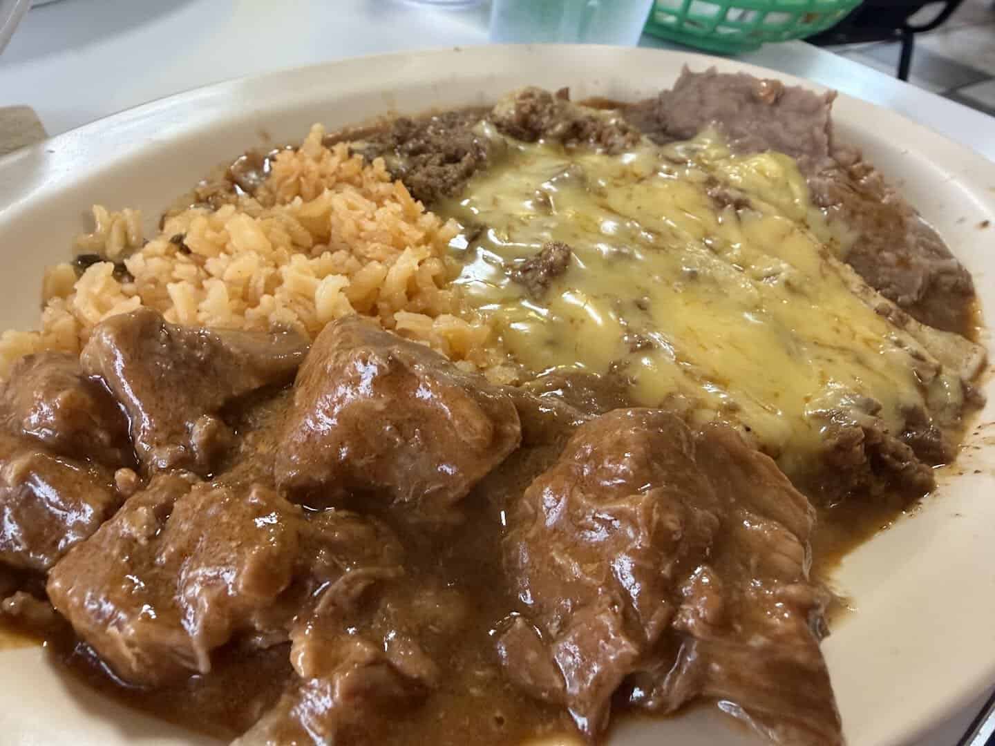 Carne guisada plate with rice and refried beans at Southside Barbacoa in Corpus Christi