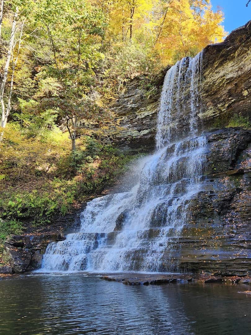 Cascade Falls dropping into its green plunge pool near Pembroke, Virginia