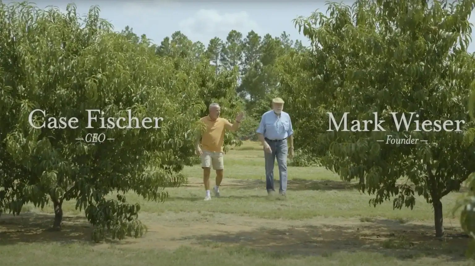 Founders Case Fischer and Mark Wieser in the peach orchard at Das Peach Haus