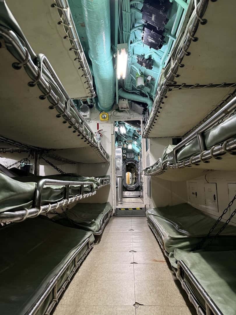 A narrow passageway inside the USS Cavalla submarine at the Galveston Naval Museum
