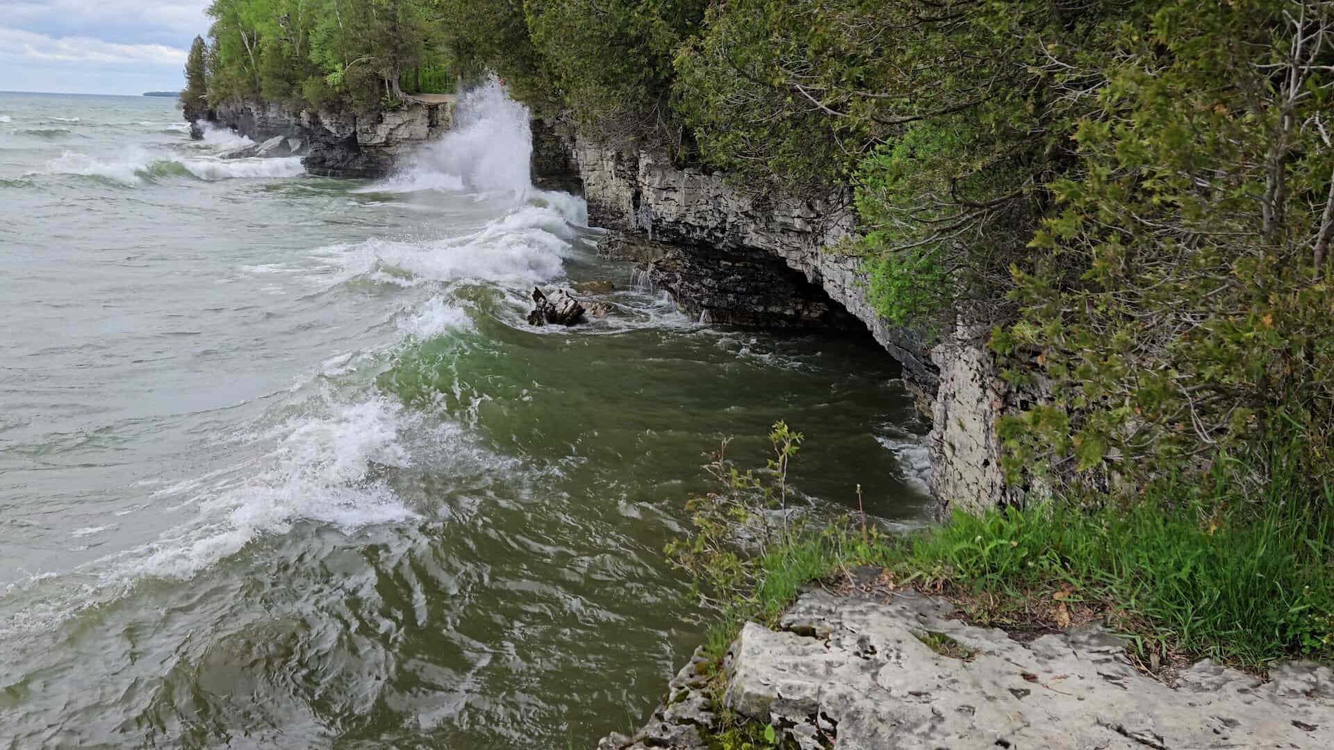 Waves breaking on the limestone cliffs at Cave Point County Park, Door County, Wisconsin