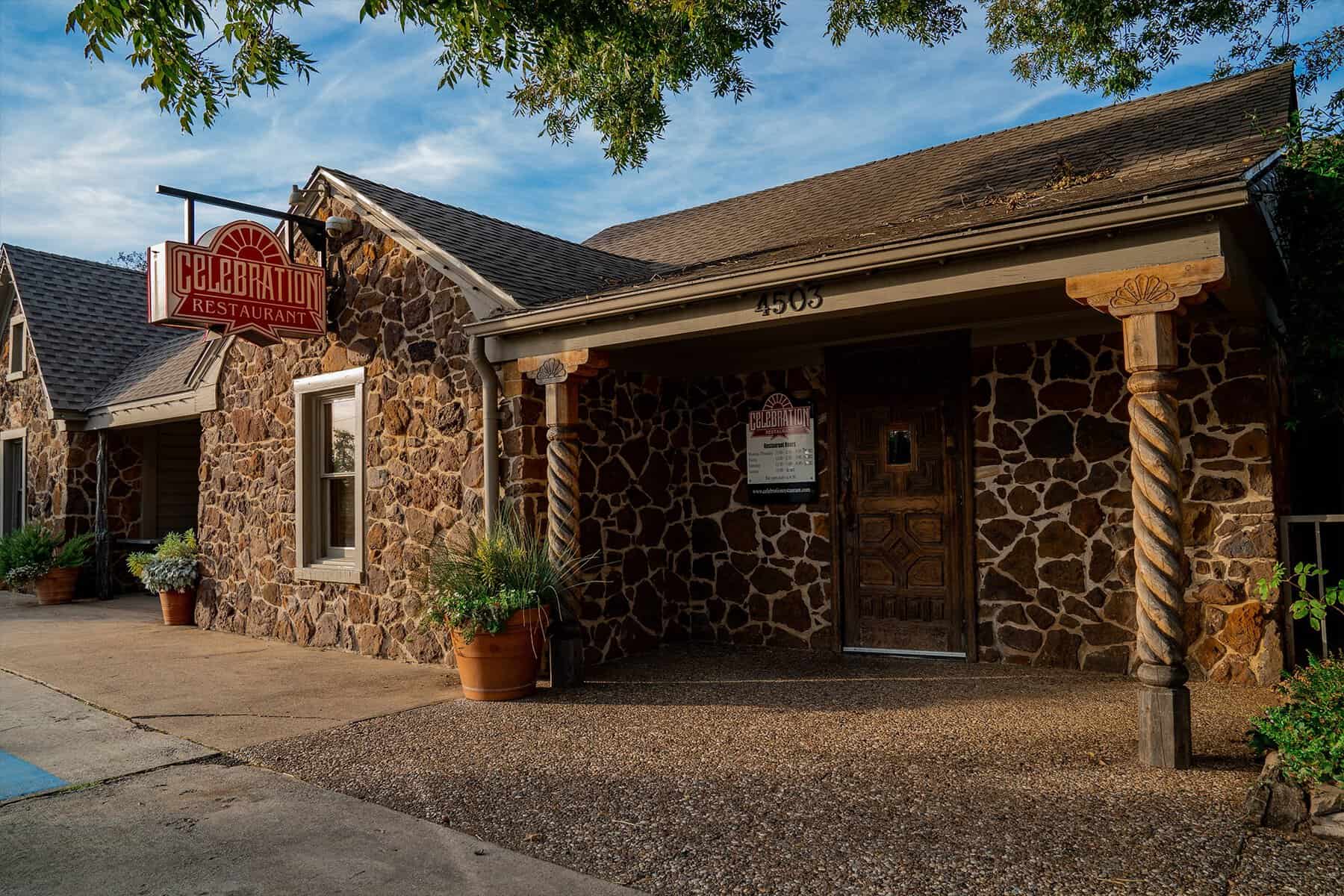 Stone exterior and sign of Celebration Restaurant on Lovers Lane in Dallas