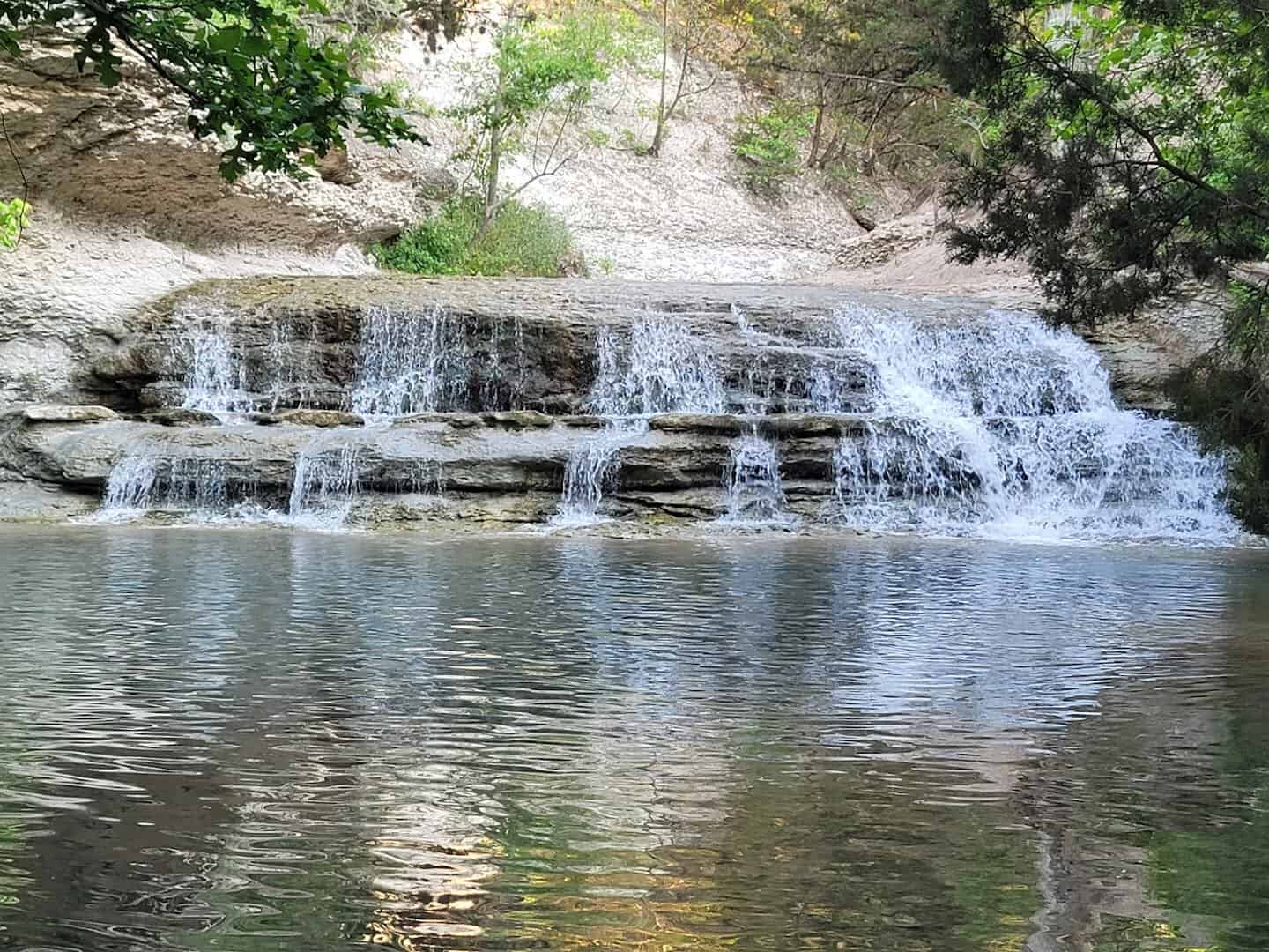 Chalk Ridge Falls tumbling over ledges into a pool near Belton, Texas