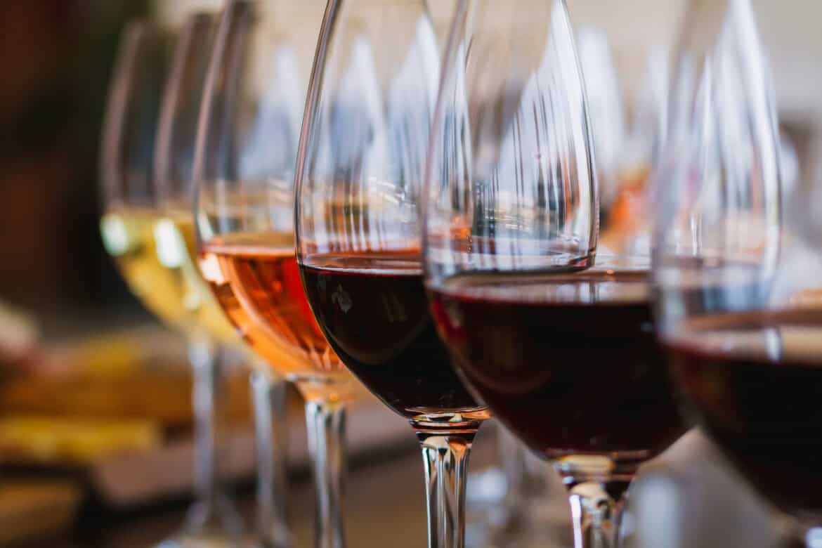 A tasting flight of red, rose, and white wines at a Connecticut Wine Trail winery