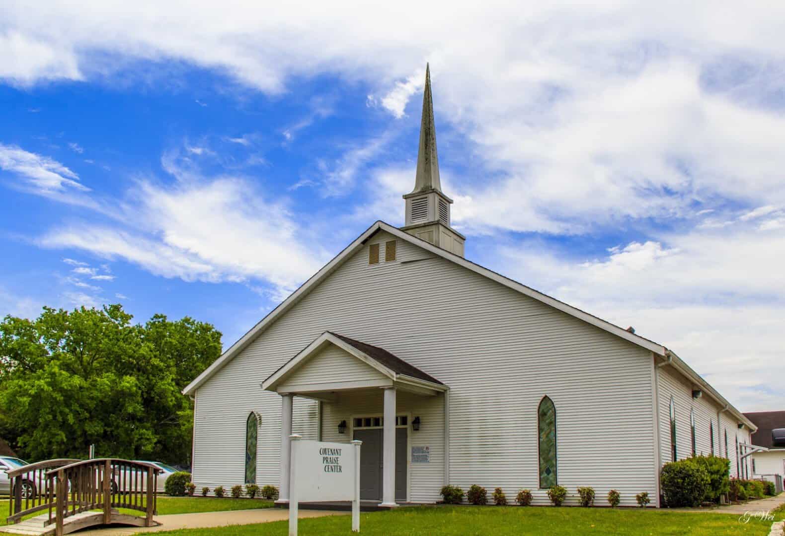 White steepled church under a blue sky in Chappell Hill, Texas