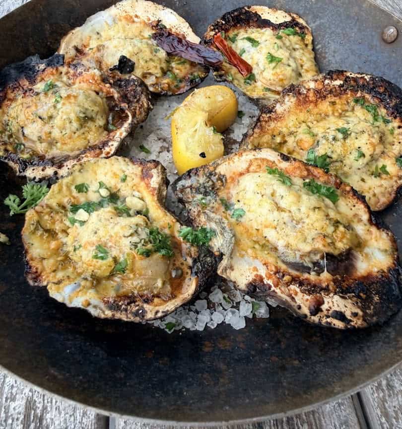 Chargrilled oysters topped with cheese and herb butter at Pier 6 in San Leon, Texas