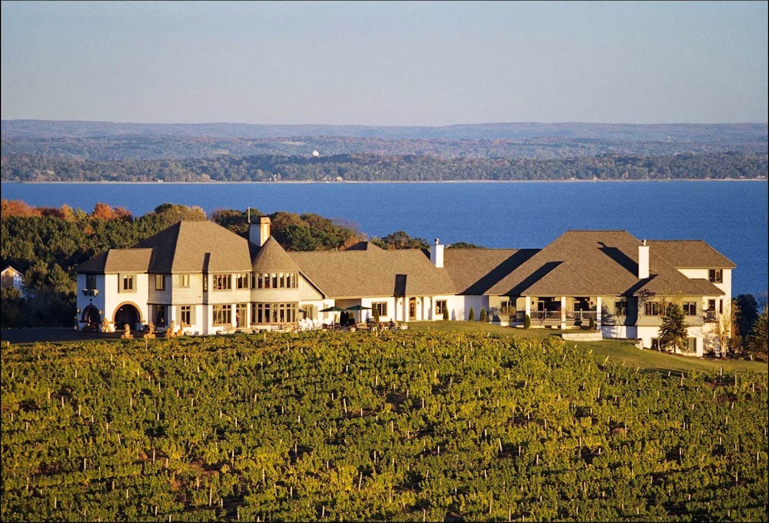 Chateau Chantal winery estate above vineyard rows overlooking Grand Traverse Bay in Traverse City, Michigan