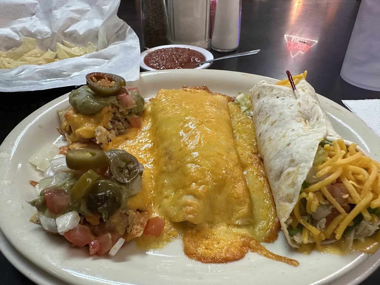 A cheese enchilada, nachos and a burrito on a Tex-Mex plate at Mary's Cafe in Strawn, Texas