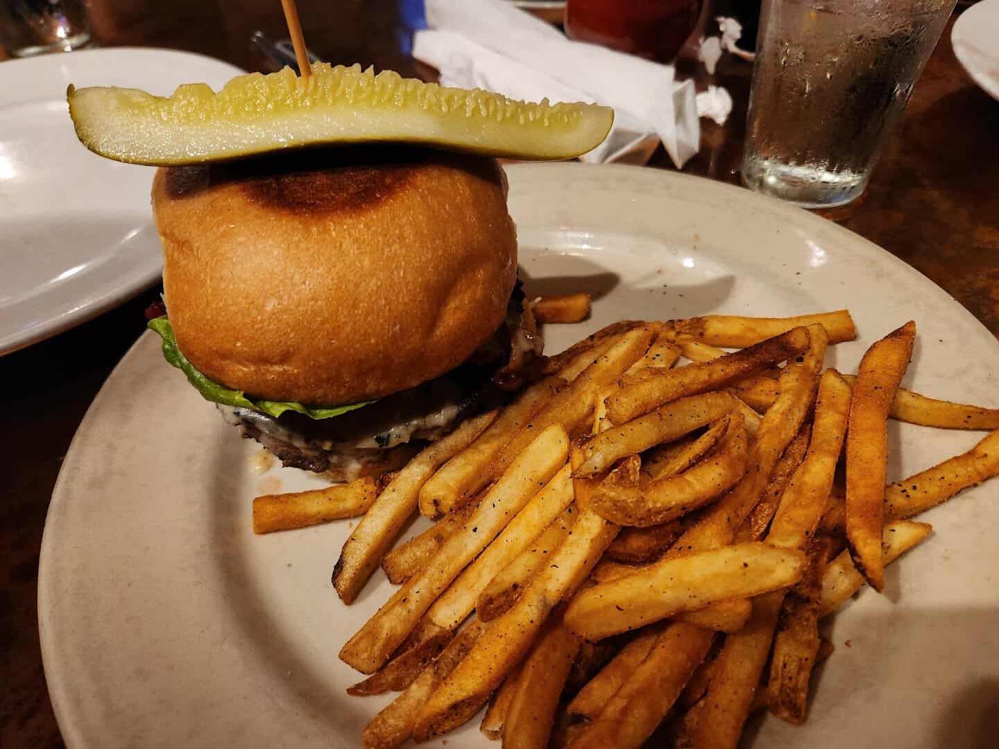 Cheeseburger with hand-cut fries and a pickle at Gruene River Grill in New Braunfels