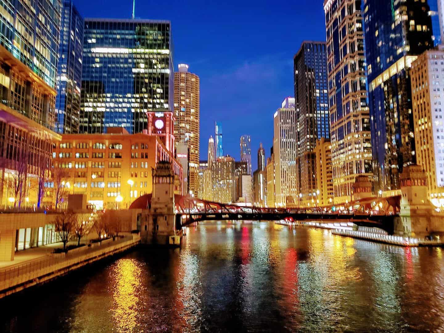 The Chicago skyline reflected in the Chicago River at dusk, Chicago, Illinois