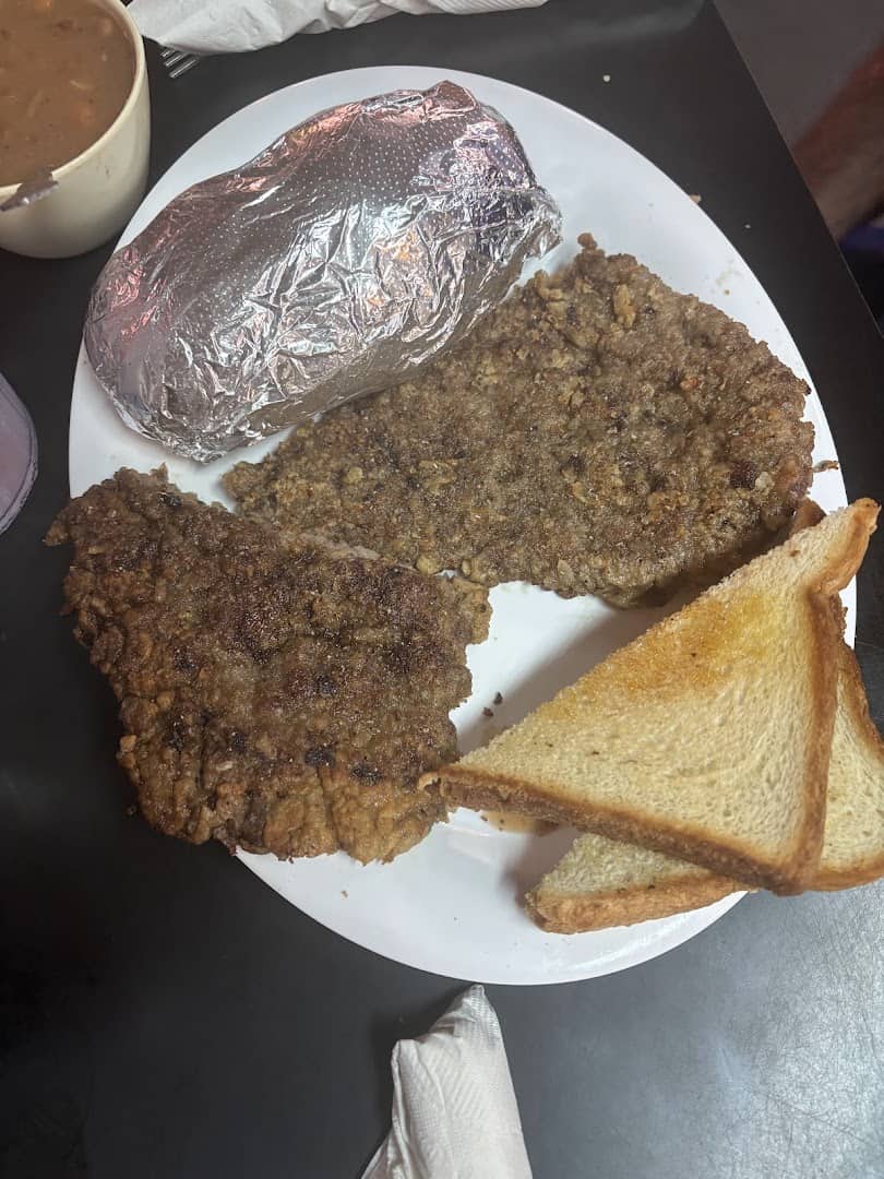 Chicken fried steak with a baked potato and Texas toast at Mary's Cafe in Strawn, Texas
